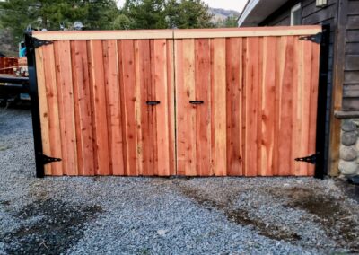 Wooden gate with metal hinges